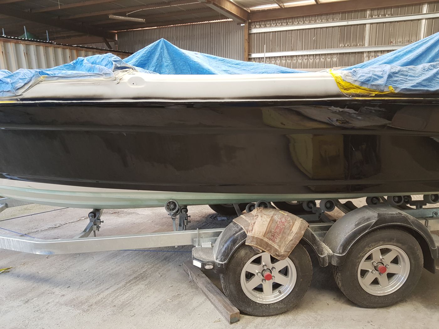 The same hull side, repaired and back to one colour.