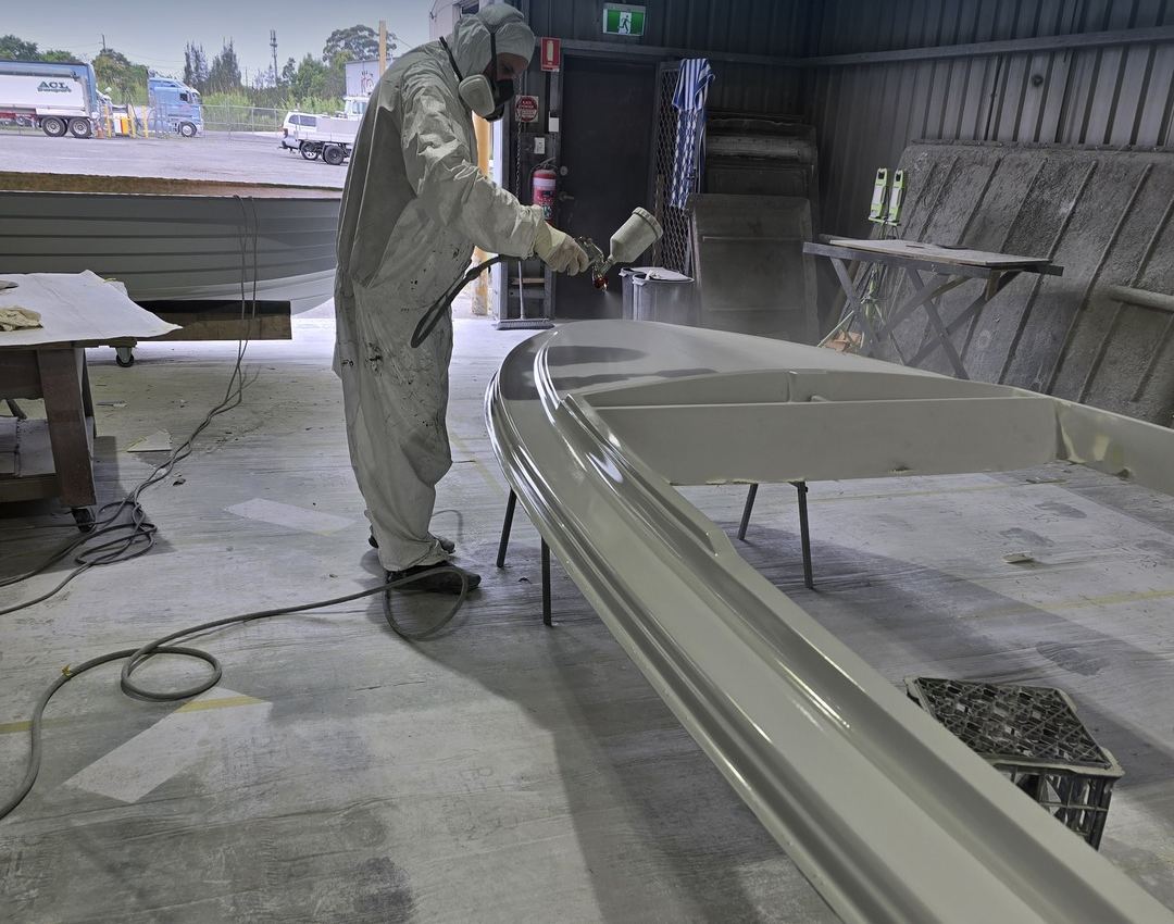 Paint going on in our spray booth.