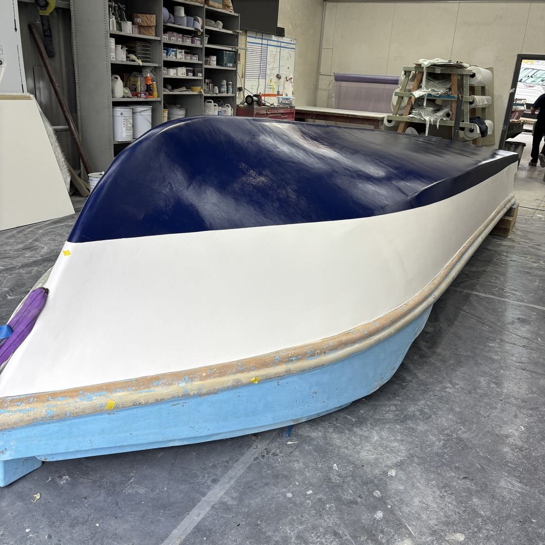 Hull sides resprayed in navy and white, bottom still to go.